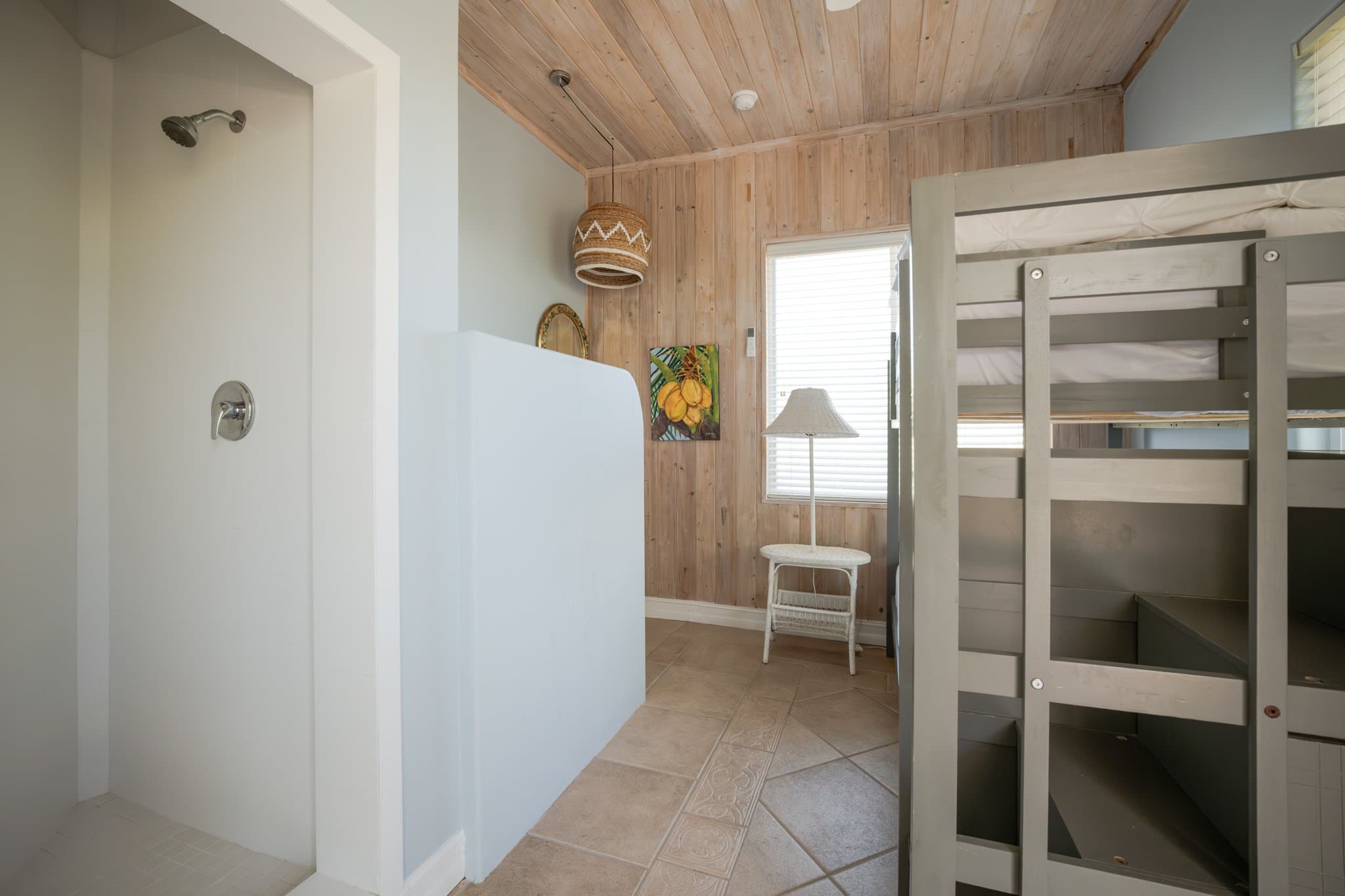 The chef's kitchen at Sugar Beach Villa with window walls of green