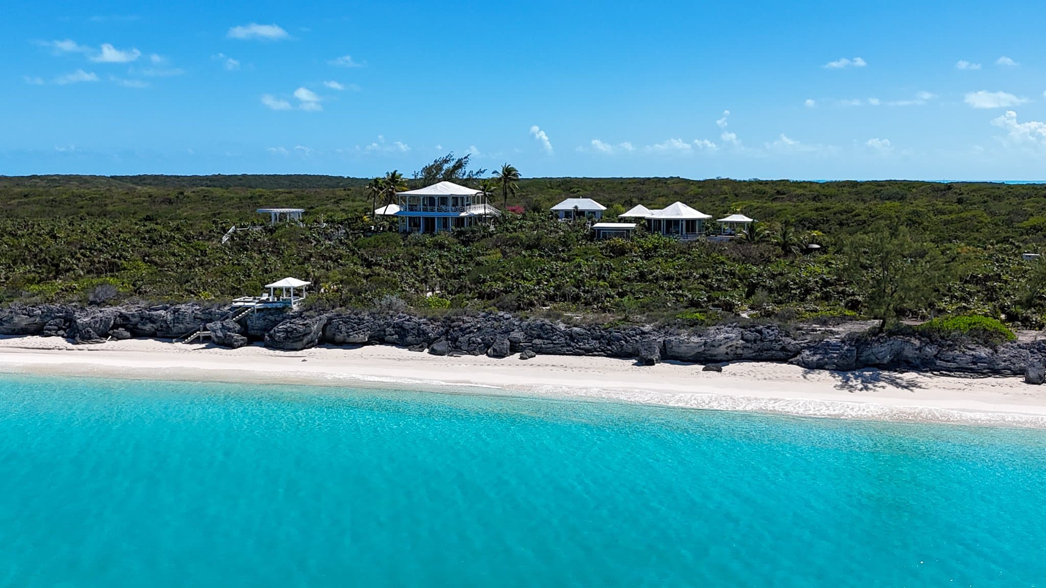 The rocky turquoise shoreline of Little Exuma near Sugar Beach Villa